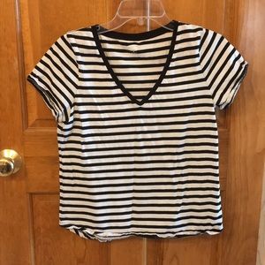 A V-neck, short sleeve, striped teeshirt.